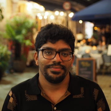 My professional picture taken in brighton near north street at night wearing a beige
                              jacket and checkered shirt